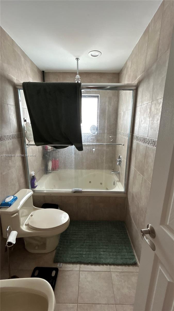 13267 Southwest 9th Lane Miami, FL 33184 - Photo 33 of 53 a bathroom with a sink and a toilet