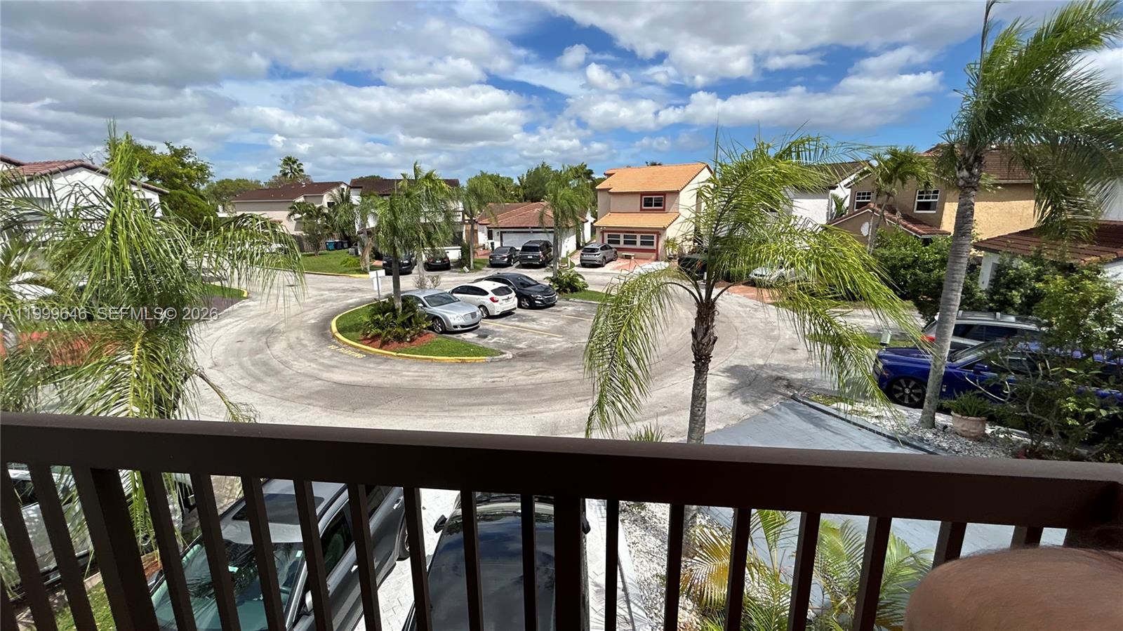 13267 Southwest 9th Lane Miami, FL 33184 - Photo 35 of 53 a view of a balcony with two chairs and a table