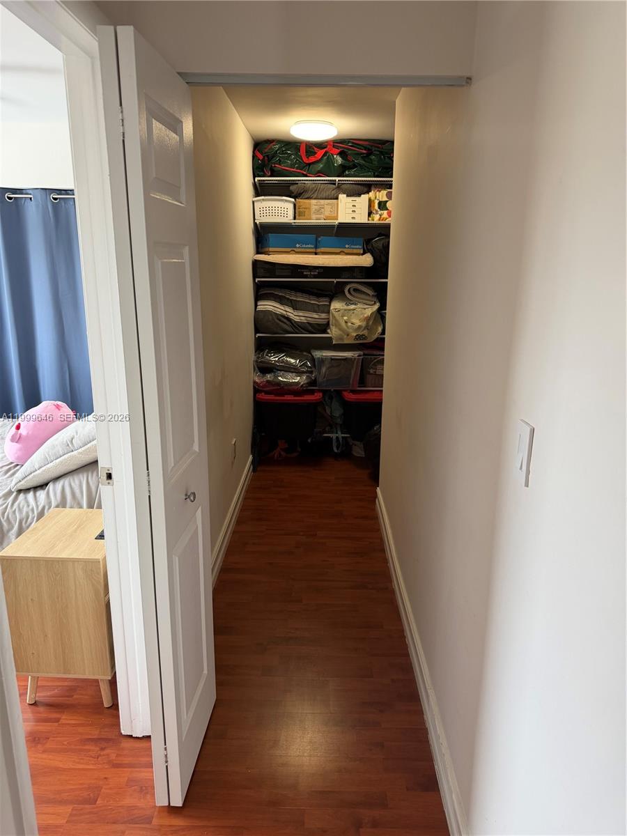 13267 Southwest 9th Lane Miami, FL 33184 - Photo 37 of 53 a view of a hallway with wooden floor and stairs