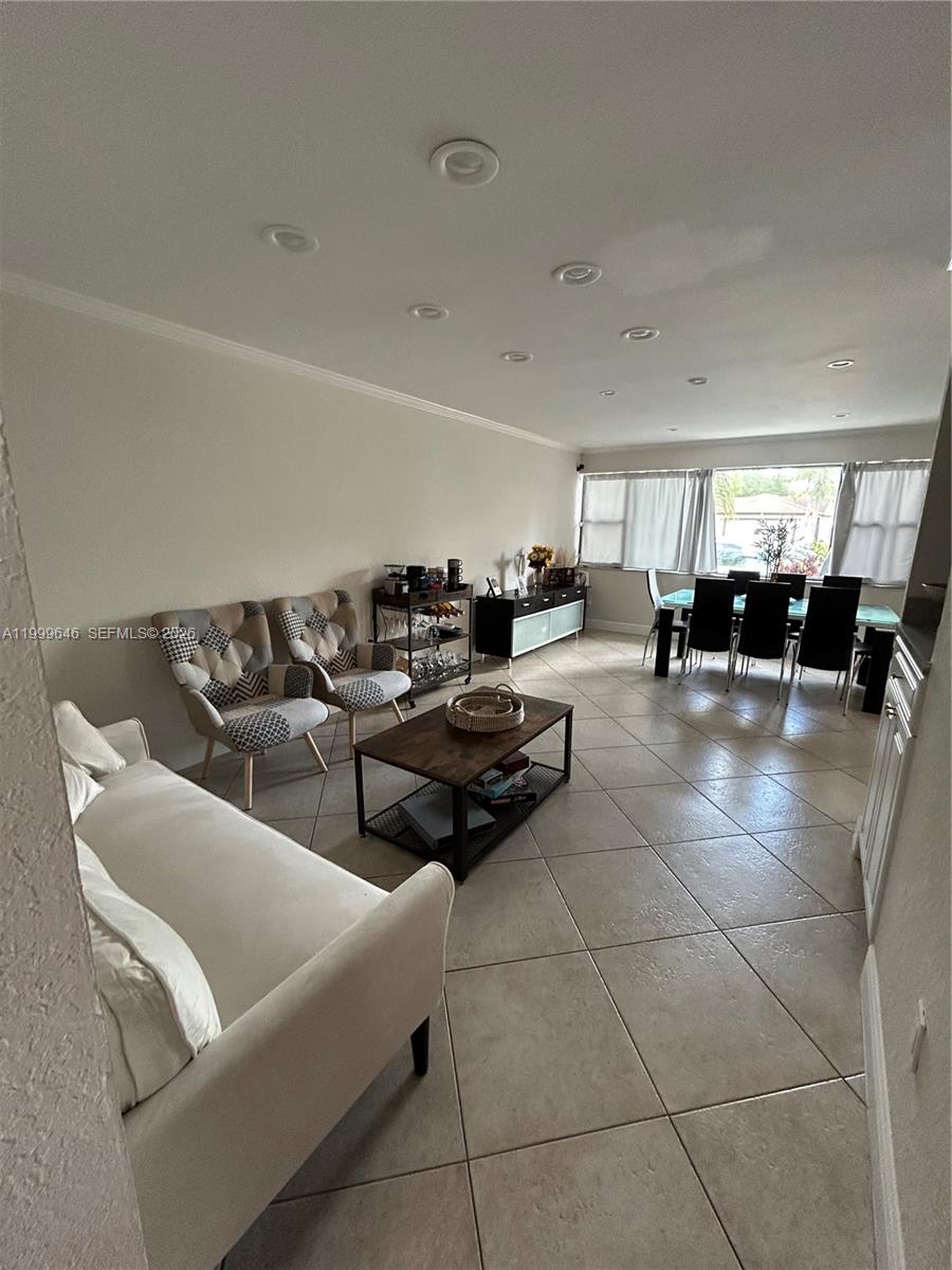 13267 Southwest 9th Lane Miami, FL 33184 - Photo 6 of 53 a living room with furniture and mirrors