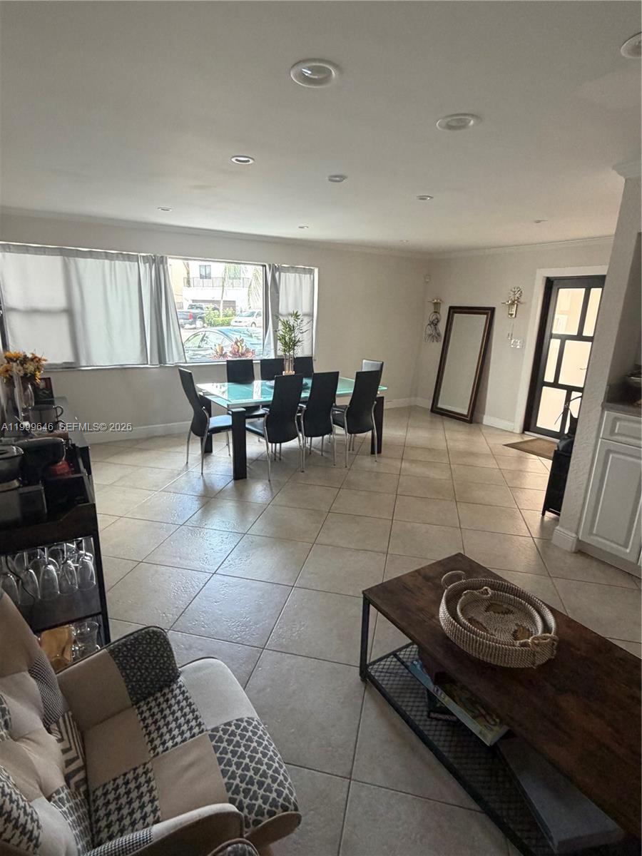 13267 Southwest 9th Lane Miami, FL 33184 - Photo 7 of 53 a living room with furniture a window and a table