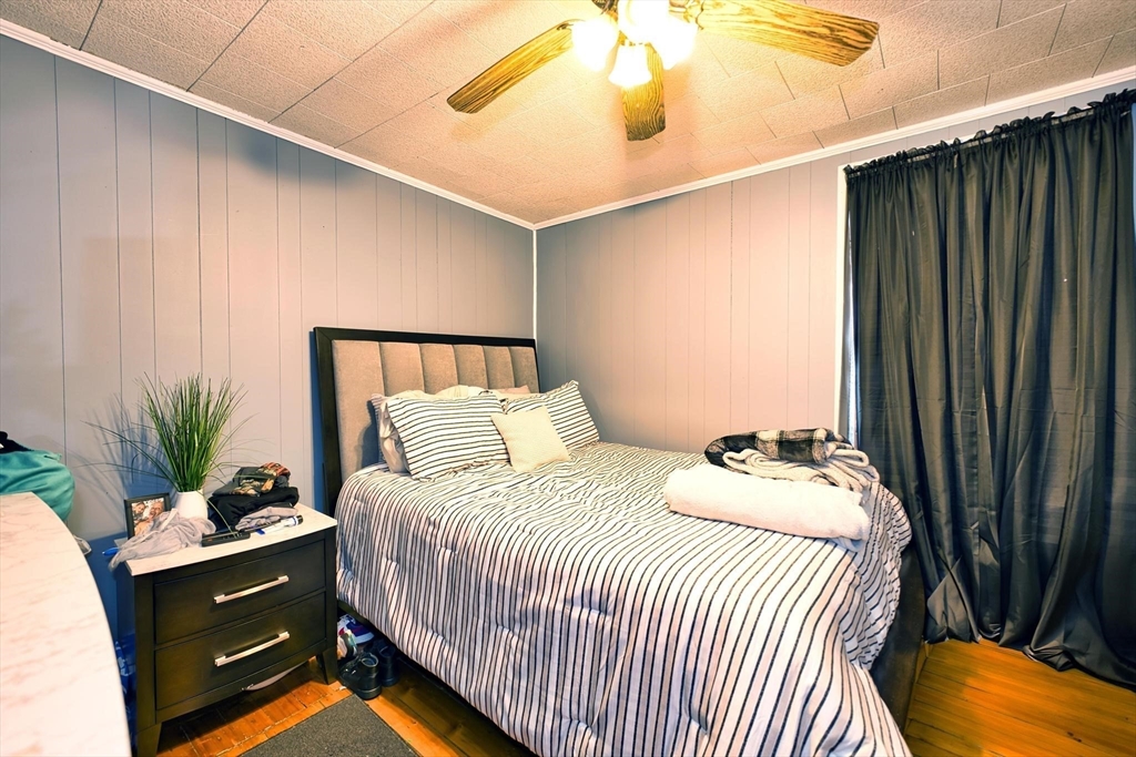 232 Alden Street Fall River, MA 02723 - Photo 13 of 34 a bedroom with a bed and a potted plant