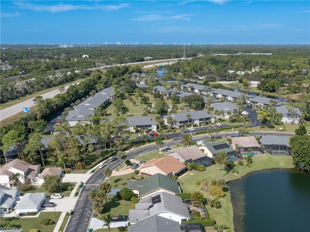 1404 Monarch Circle Naples, FL 34116 - Photo 3 of 33 an aerial view of residential houses with outdoor space