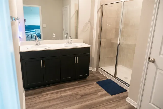 a bathroom with a sink vanity and a mirror