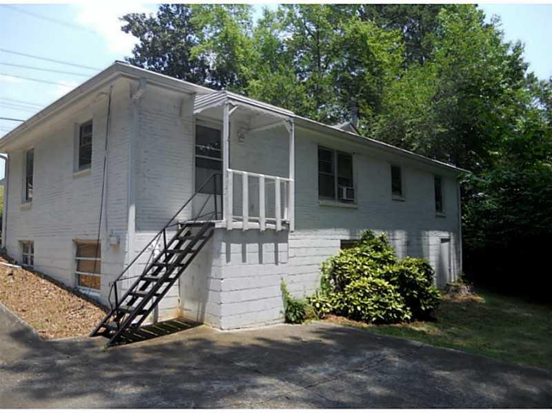 4267 Chamblee Tucker Road Atlanta, GA 30340 - Photo 3 of 12 a view of a house with a yard