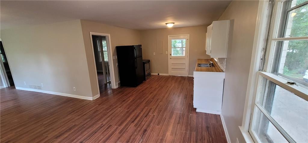 4267 Chamblee Tucker Road Atlanta, GA 30340 - Photo 4 of 12 a view of a livingroom with wooden floor and a window
