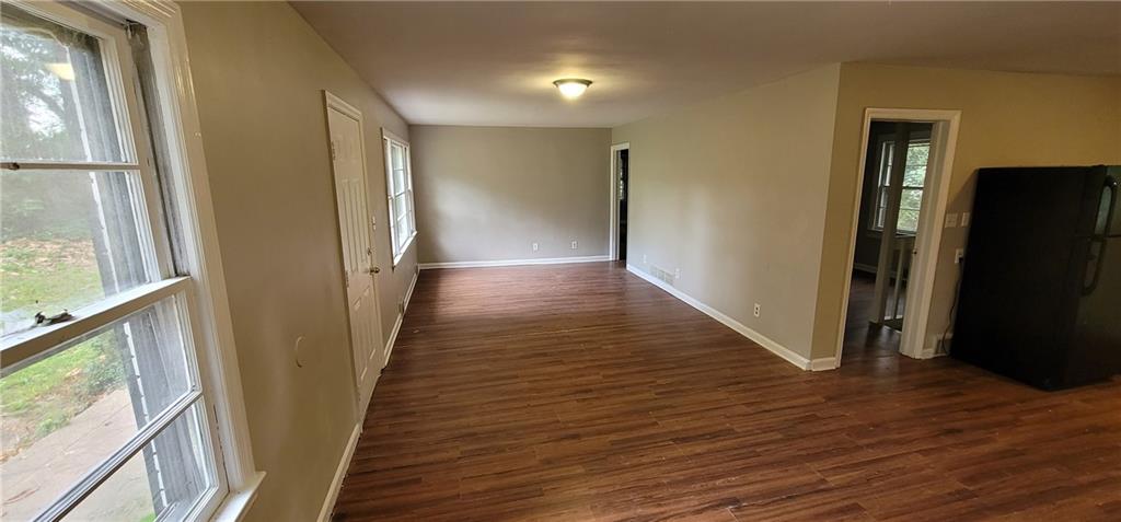 4267 Chamblee Tucker Road Atlanta, GA 30340 - Photo 5 of 12 a view of hallway with wooden floor and stairs