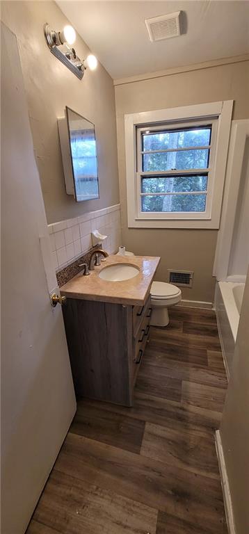 4267 Chamblee Tucker Road Atlanta, GA 30340 - Photo 9 of 12 a room with wooden floor and window