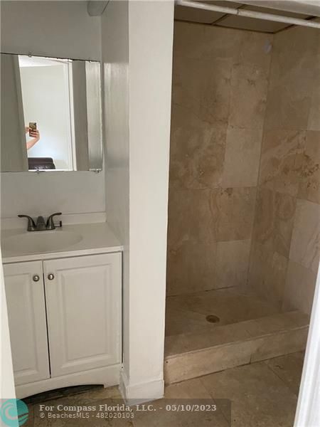 8020 Fairview Drive, Unit 101 Tamarac, FL 33321 - Photo 11 of 15 a bathroom with a shower