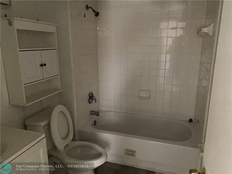 8020 Fairview Drive, Unit 101 Tamarac, FL 33321 - Photo 12 of 15 a bathroom with a sink a toilet and shower