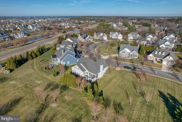 an aerial view of a house with a swimming pool