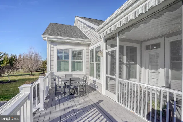 a view of a house with backyard sitting area and garden