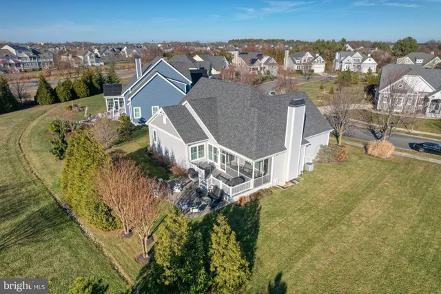 an aerial view of residential houses with outdoor space