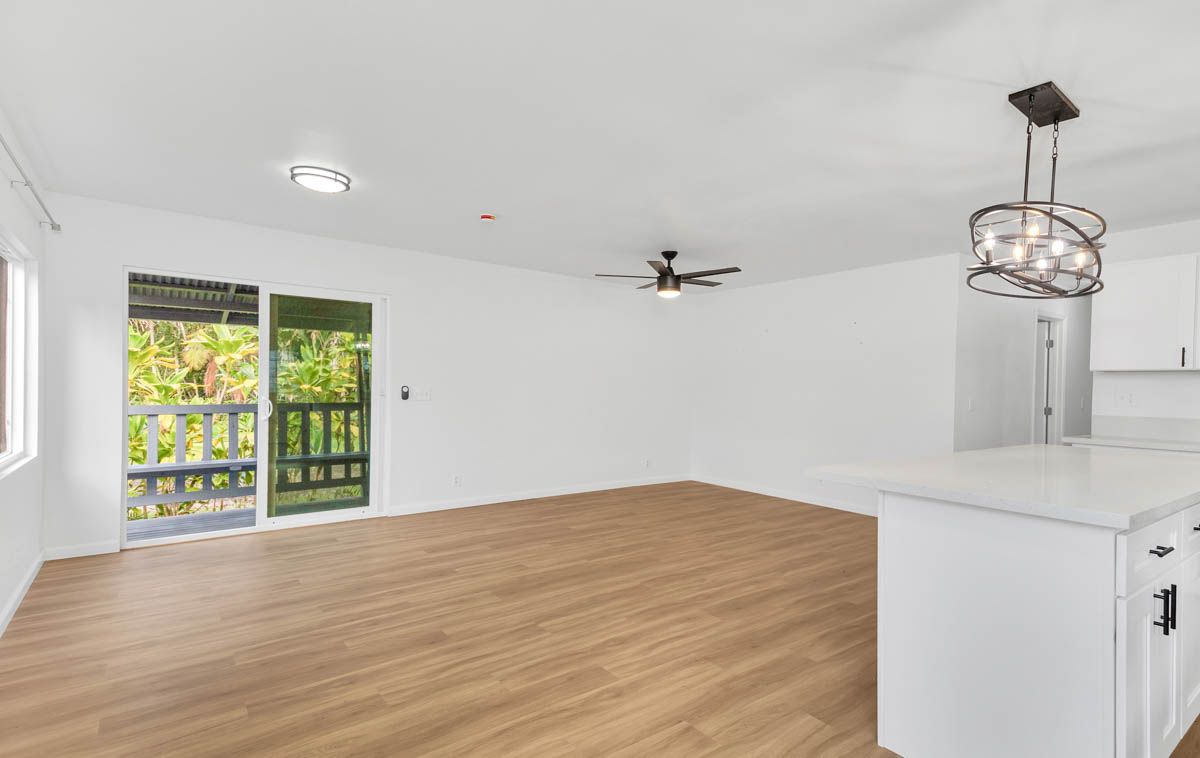 15-385 Puni Makai Loop North Pahoa, HI 96778 - Photo 11 of 22 a view of a room with wooden floor fan and windows