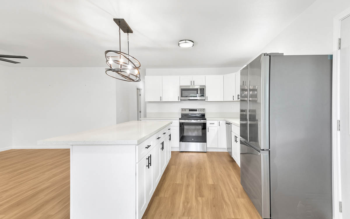 15-385 Puni Makai Loop North Pahoa, HI 96778 - Photo 12 of 22 a kitchen with stainless steel appliances a refrigerator sink and stove