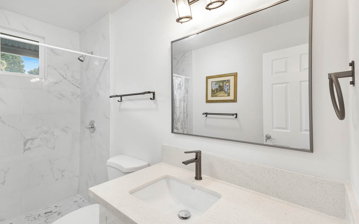 15-385 Puni Makai Loop North Pahoa, HI 96778 - Photo 16 of 22 a bathroom with a sink a toilet and shower