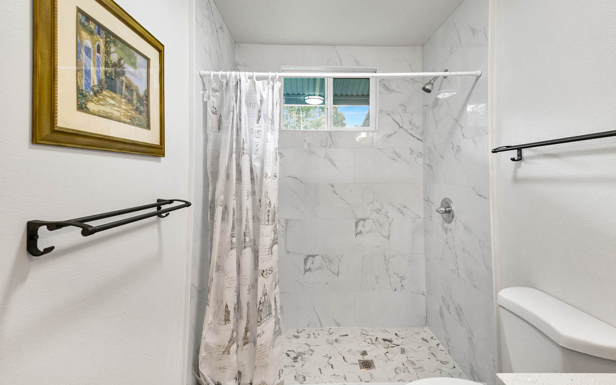 15-385 Puni Makai Loop North Pahoa, HI 96778 - Photo 17 of 22 a bathroom with a shower and a toilet