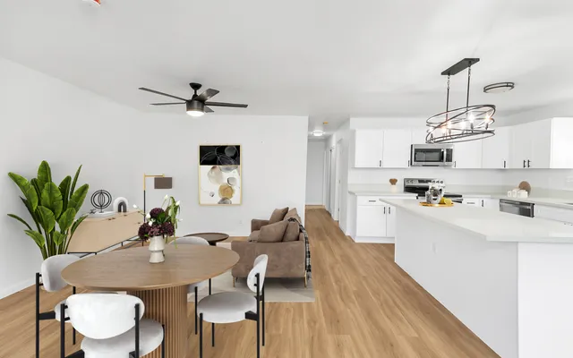 a view of kitchen with sink and refrigerator