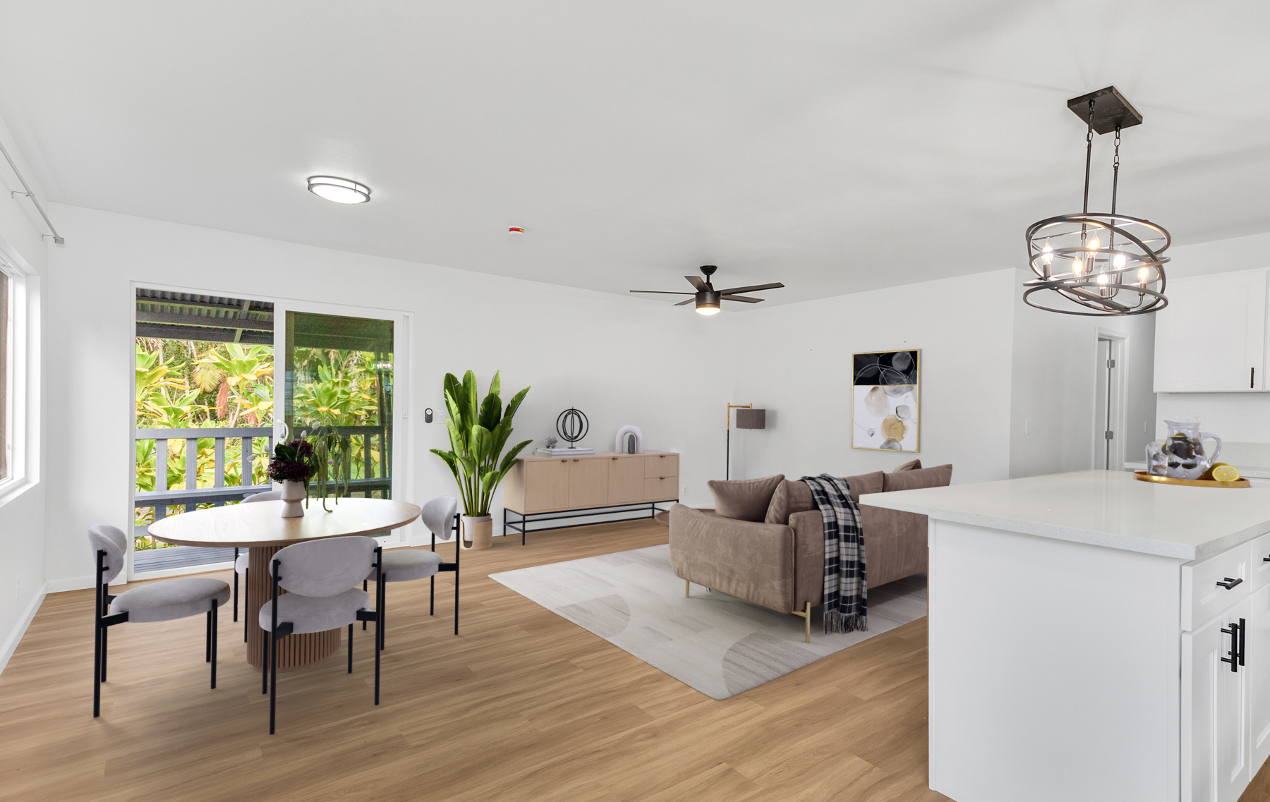 15-385 Puni Makai Loop North Pahoa, HI 96778 - Photo 10 of 22 a living room with furniture a window and a chandelier
