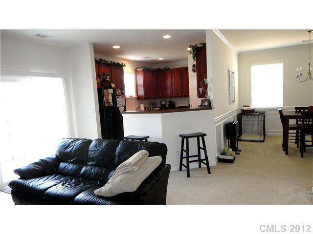 3343 Streamside Drive Davidson, NC 28036 - Photo 4 of 16 a living room with furniture and a flat screen tv