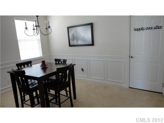 3343 Streamside Drive Davidson, NC 28036 - Photo 5 of 16 a kitchen with a dining table and chairs