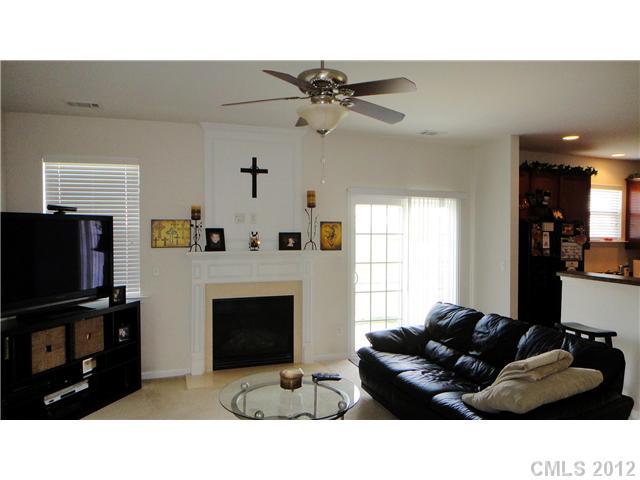 3343 Streamside Drive Davidson, NC 28036 - Photo 6 of 16 a living room with furniture and a flat screen tv
