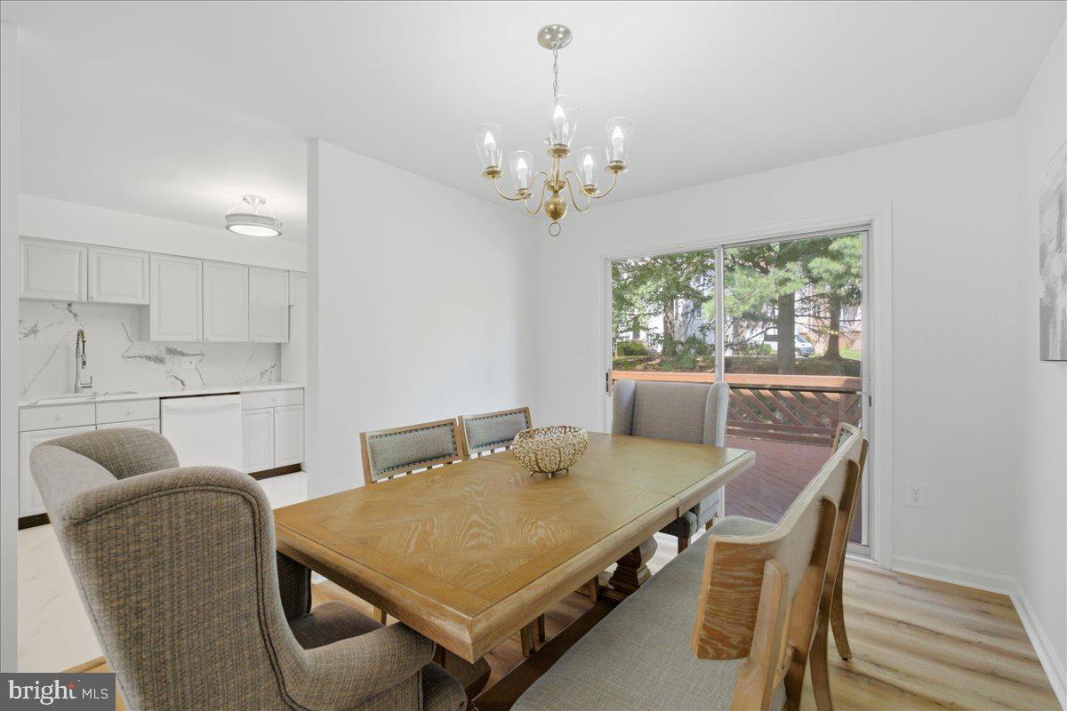 8902 Winding Hollow Way Springfield, VA 22152 - Photo 5 of 34 Open dining space with updated flooring.
