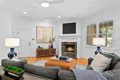 a living room with furniture and a fireplace