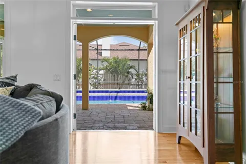 a view of swimming pool with a bench in front of it