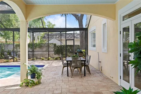 a view of swimming pool with outdoor seating