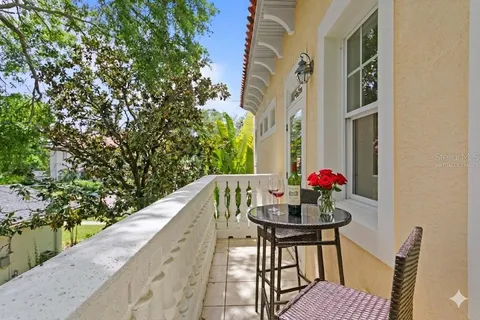 a spacious bathroom with a granite countertop double vanity sink a mirror and a