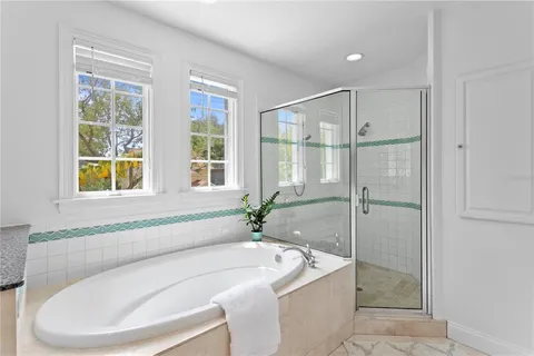 a bedroom with furniture and a potted plant