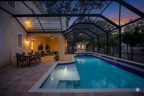 a view of a swimming pool with sitting area