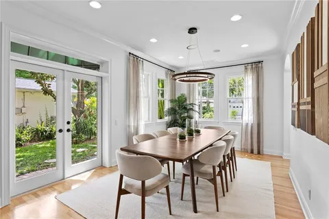 a view of a dining room with furniture window and wooden floor
