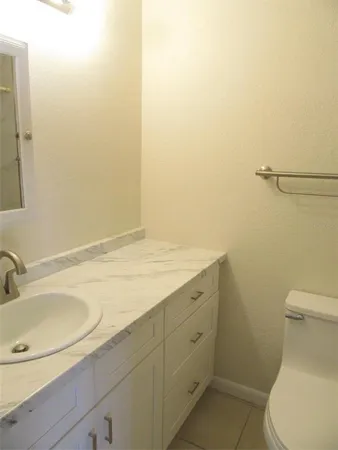 a bathroom with a sink and a toilet