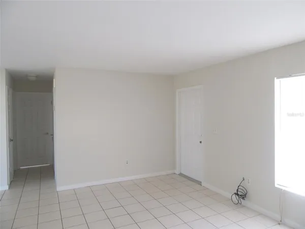 a view of an empty room and window