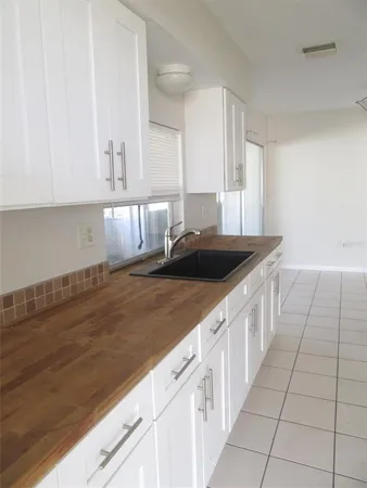 a kitchen with a sink and cabinets