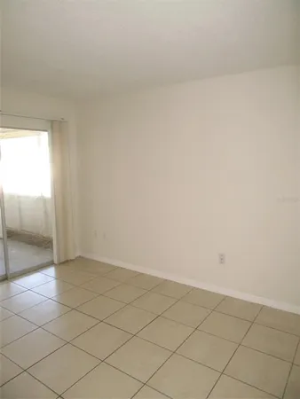 a view of an empty room and an entryway