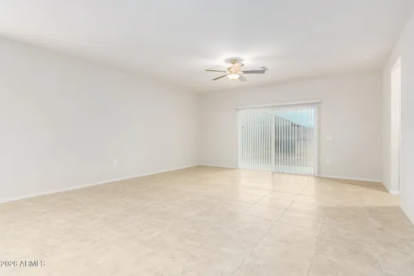 a view of an empty room with a fan