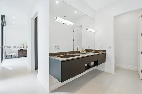 a kitchen with stainless steel appliances granite countertop a stove and a refrigerator