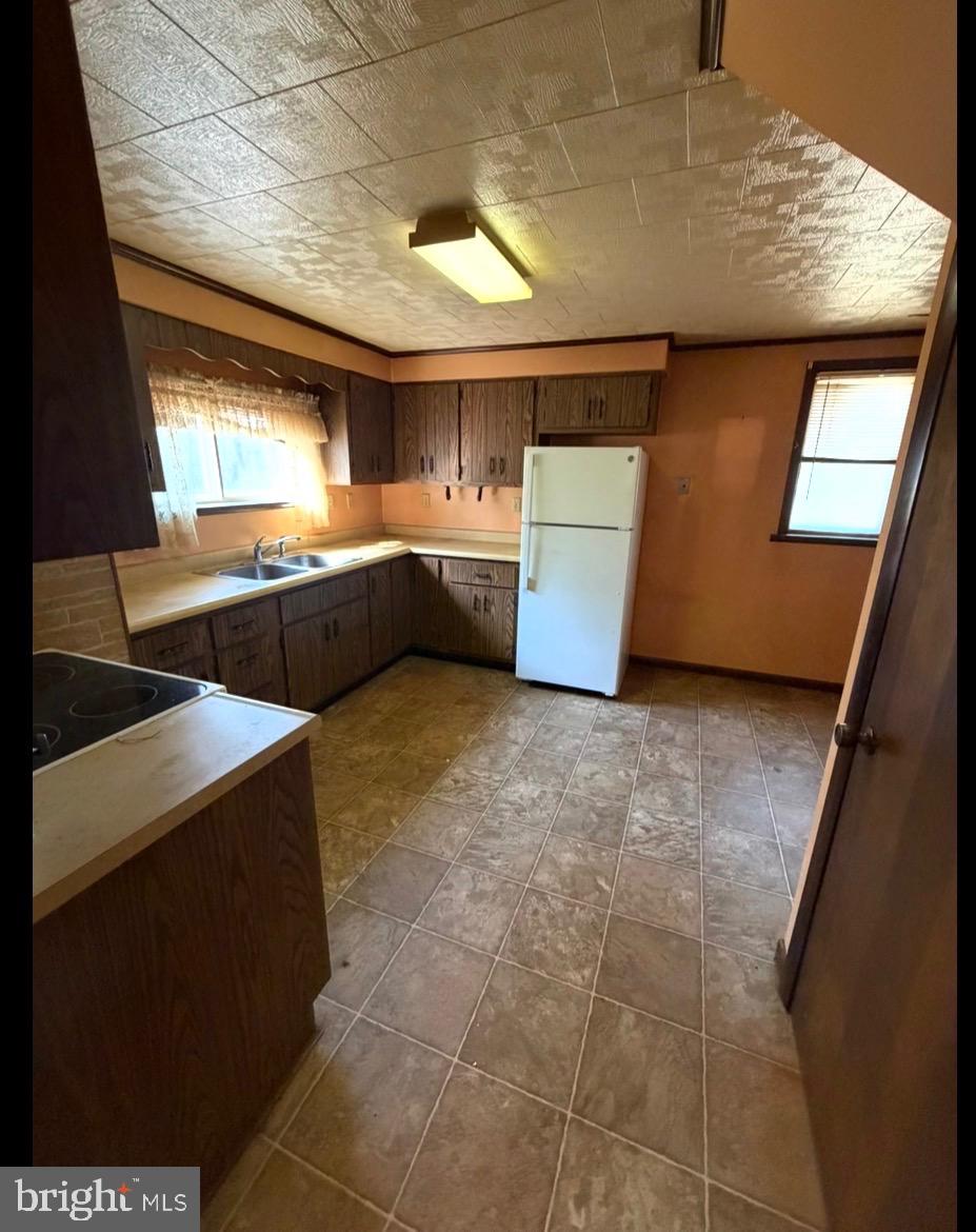 309 Gibson Avenue Monongahela, PA 15063 - Photo 26 of 29 a kitchen with stainless steel appliances kitchen island granite countertop a sink and cabinets