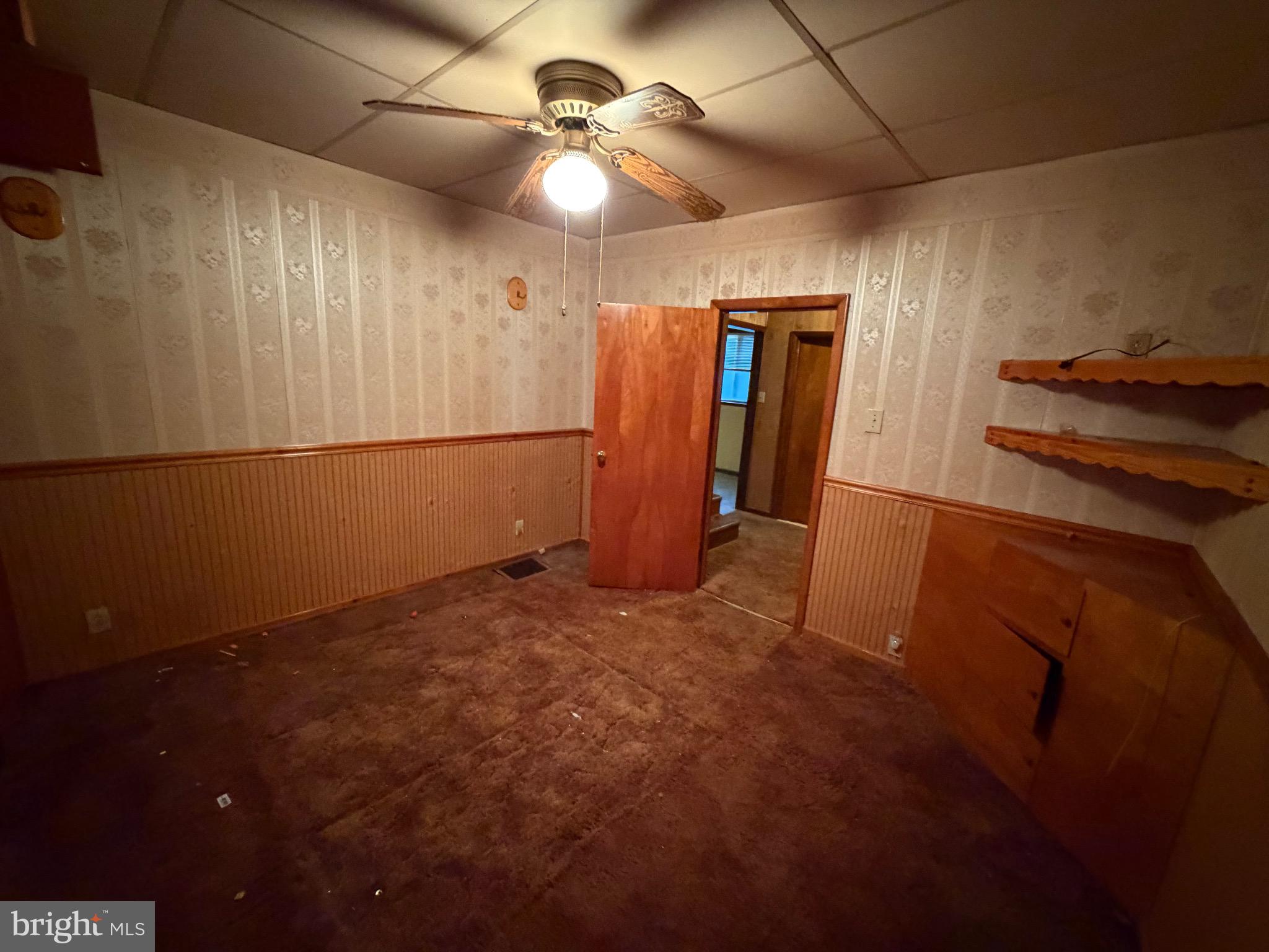 309 Gibson Avenue Monongahela, PA 15063 - Photo 8 of 29 a view of a livingroom with a ceiling fan and wooden floor