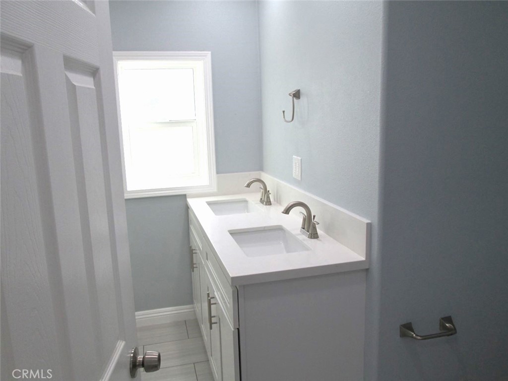44552 Arabia Street Indio, CA 92201 - Photo 21 of 49 a bathroom with a sink and a mirror