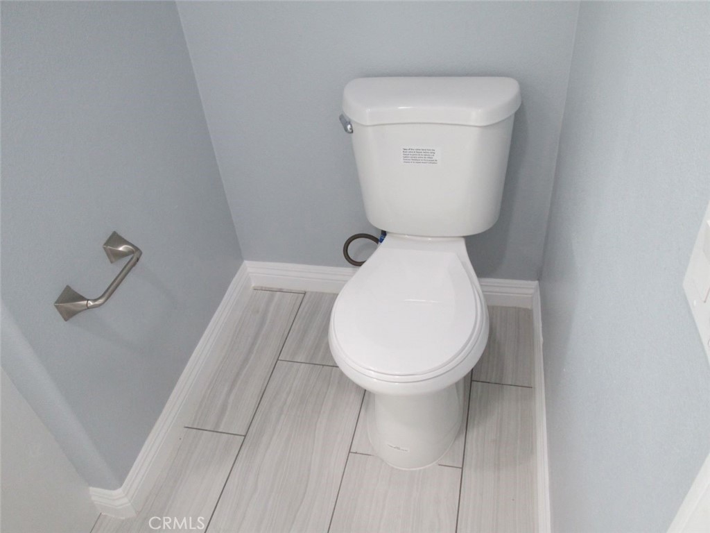 44552 Arabia Street Indio, CA 92201 - Photo 22 of 49 a close view of a toilet in a bathroom