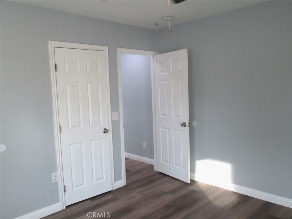 44552 Arabia Street Indio, CA 92201 - Photo 24 of 49 a view of empty room with wooden floor
