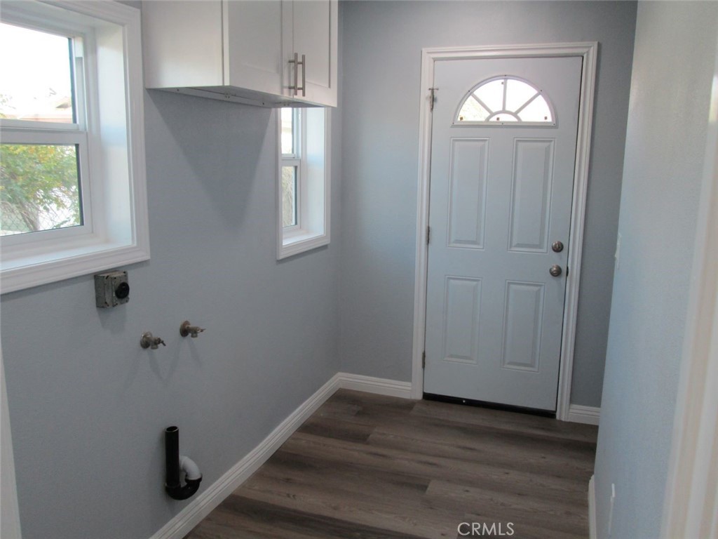 44552 Arabia Street Indio, CA 92201 - Photo 26 of 49 an empty room with wooden floor closet and windows