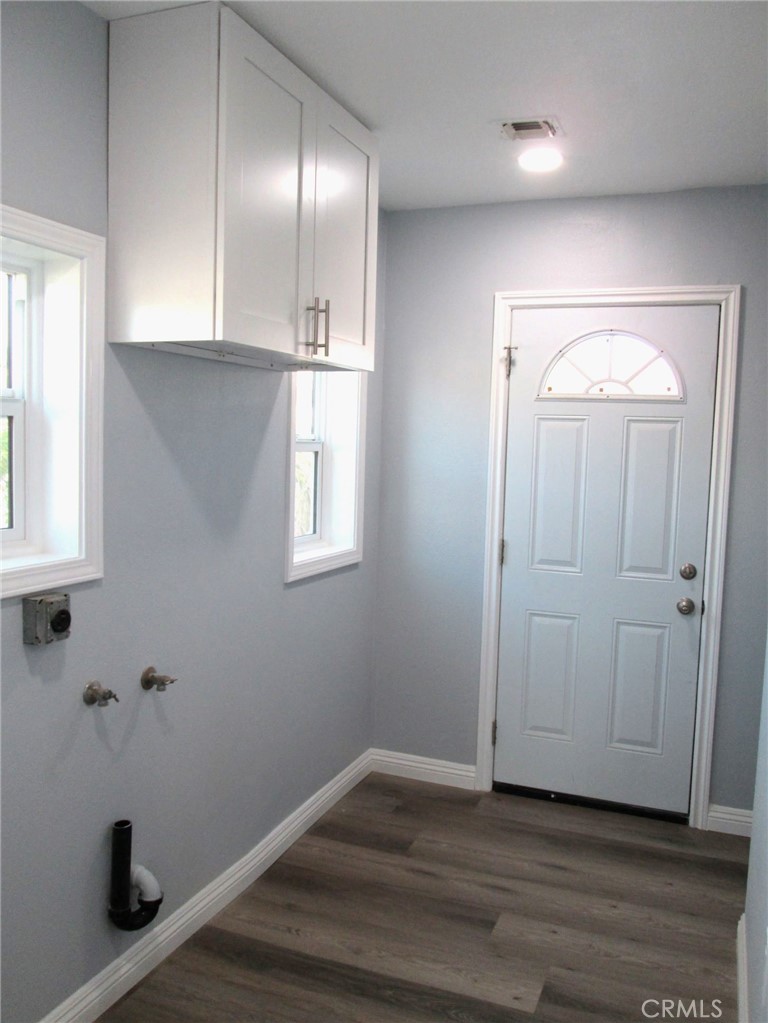 44552 Arabia Street Indio, CA 92201 - Photo 29 of 49 a view of an empty room with wooden floor and closet