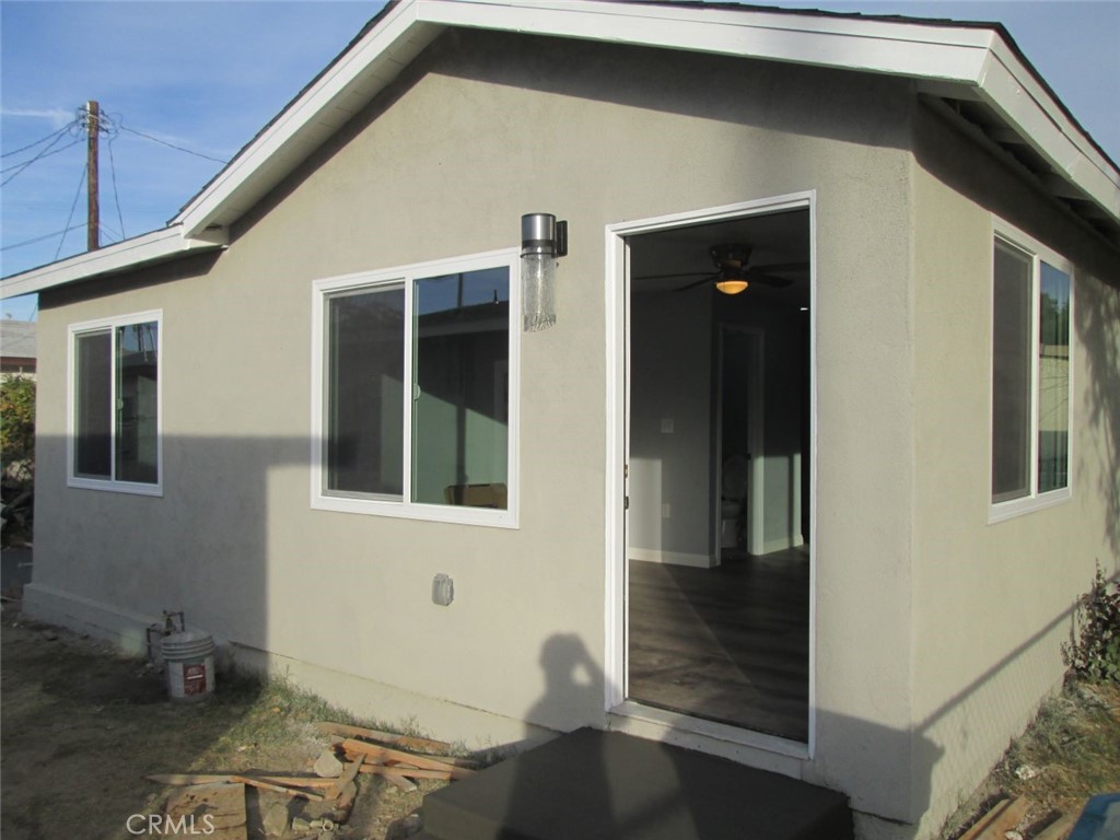 44552 Arabia Street Indio, CA 92201 - Photo 32 of 49 a front view of a house with glass windows