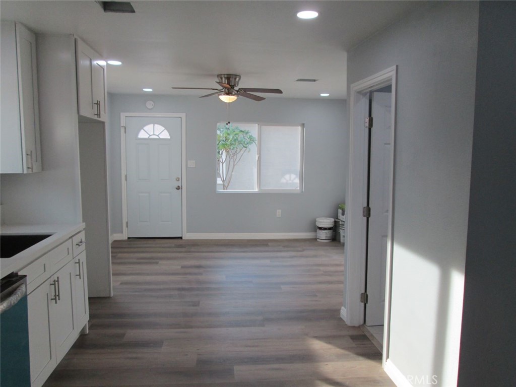 44552 Arabia Street Indio, CA 92201 - Photo 36 of 49 a view of an empty room with a window and wooden floor