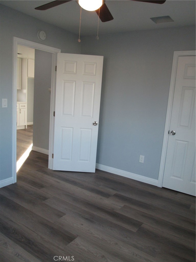 44552 Arabia Street Indio, CA 92201 - Photo 45 of 49 a view of an empty room with wooden floor
